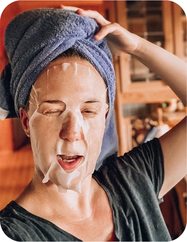 Member enjoying a face mask and self-care moment